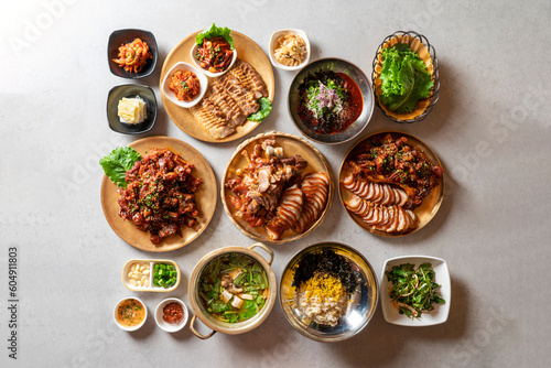 Jokbal, pork feet, steamed, salted oysters, spicy, noodles, garlic Korean food dish 