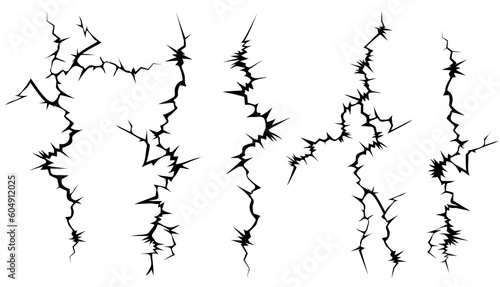 Cracks in the surface. Set of black and white vector cracks.