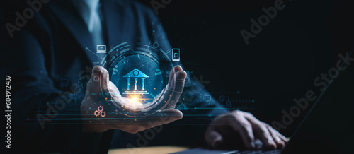 Man holding Digital virtual bank on network of Financial data and banking and Decentralized Finance.Digital banking, Virtual bank, Online banking and digital money.cyber security.big data