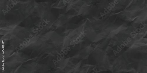 Black creased crumpled paper texture can be use as background. Ragged black Paper. black waxed packing paper texture. 