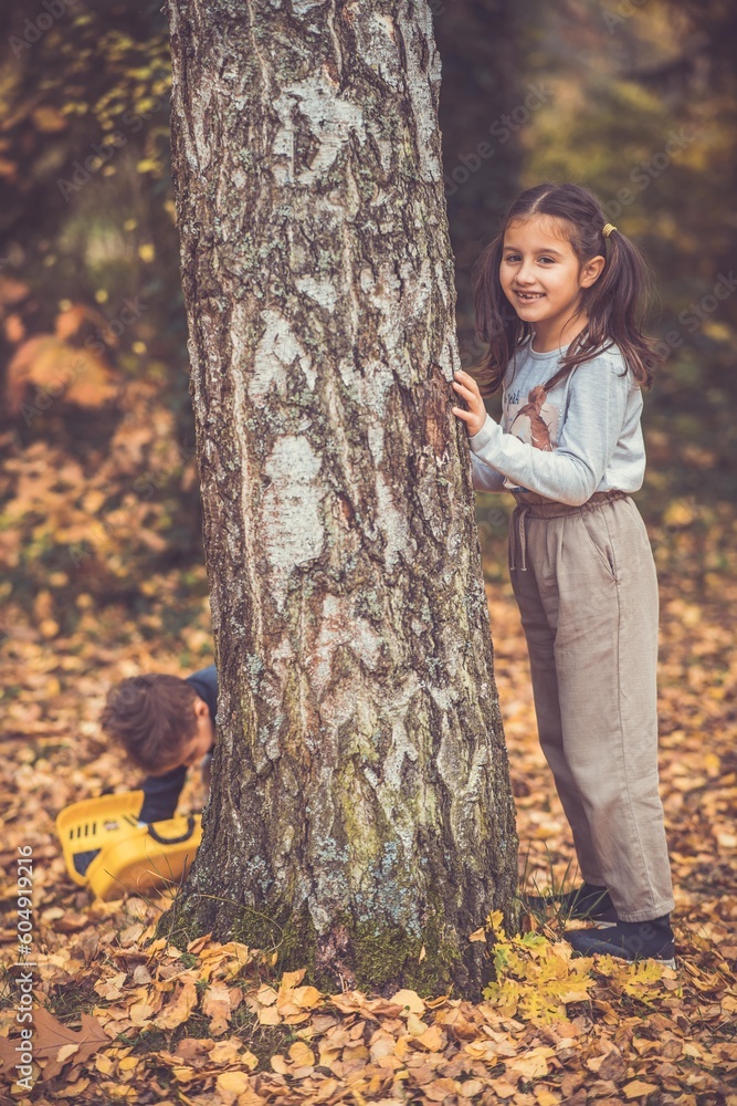 Child in the forest smiling and playing Child in the forest smiling and playing