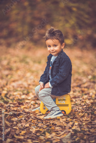 Child in the forest smiling and playing