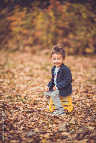 Child in the forest smiling and playing
