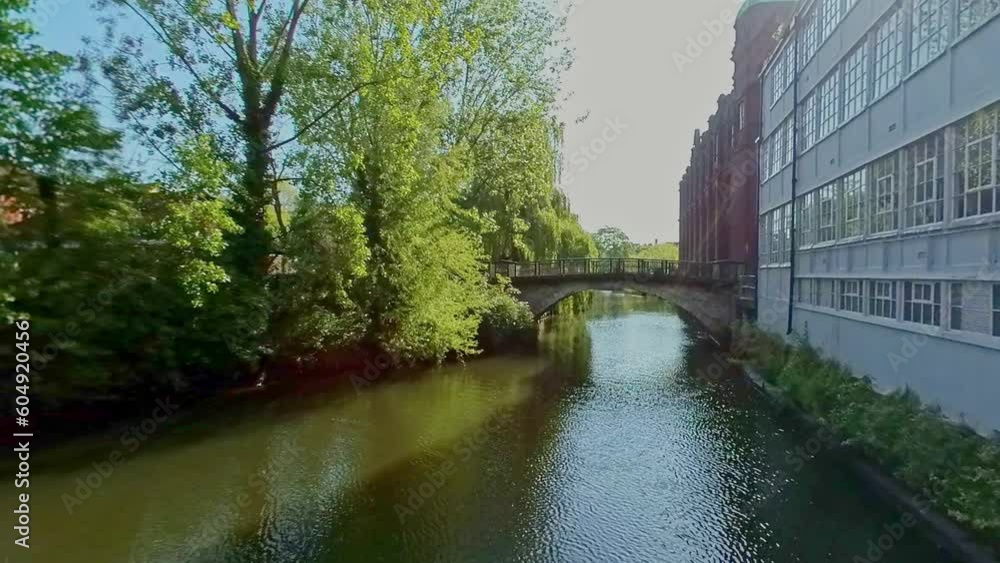 Panning shot across the River Wensum towards St George's Bridge in the city of Norwich. Captured on a bright and sunny morning Panning shot across the River Wensum towards St George's Bridge in the city of Norwich. Captured on a bright and sunny morning