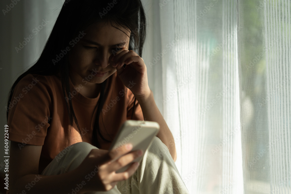 Depression and mental illness. Asian woman disappointed, sad after receiving bad news. Stressed girl confused with unhappy problems, arguing with boyfriend, cry and worry about unexpected pregnancy. Depression and mental illness. Asian woman disappointed, sad after receiving bad news. Stressed girl confused with unhappy problems, arguing with boyfriend, cry and worry about unexpected pregnancy.