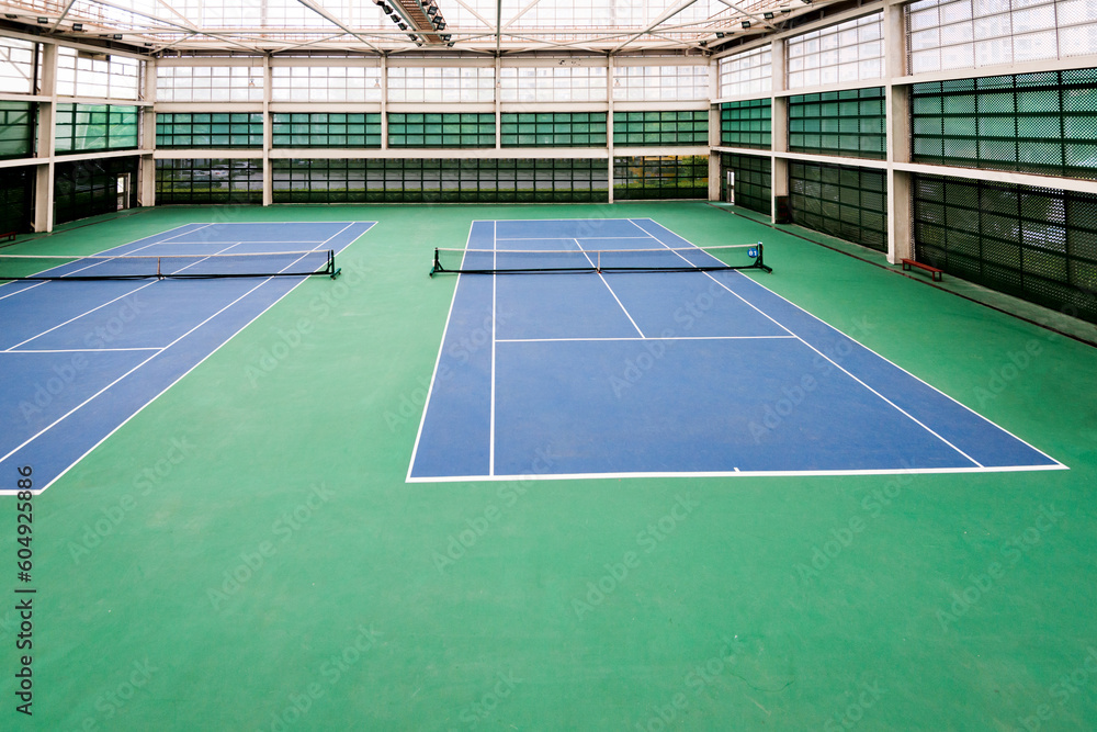Indoor tennis court with nobody