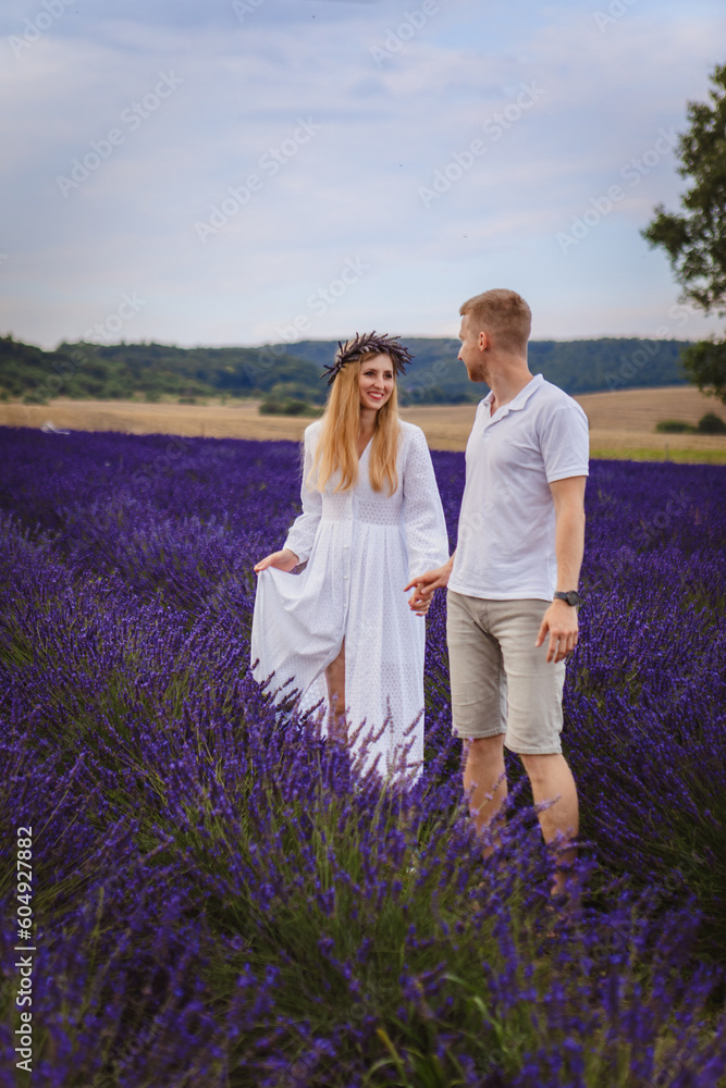 a couple in love is walking in a lavender field a couple in love is walking in a lavender field
