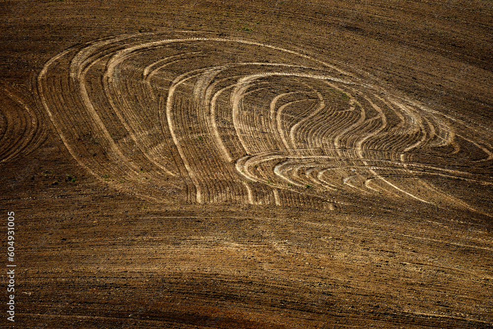 Rolling Plowed Field on Farm with Furrow Marks and Rows Texture