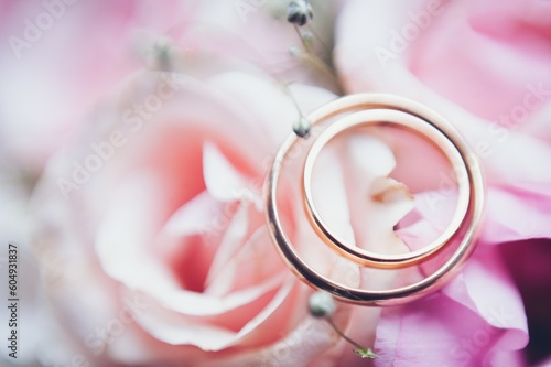 pink flower close up of wedding bouquet and wedding rings