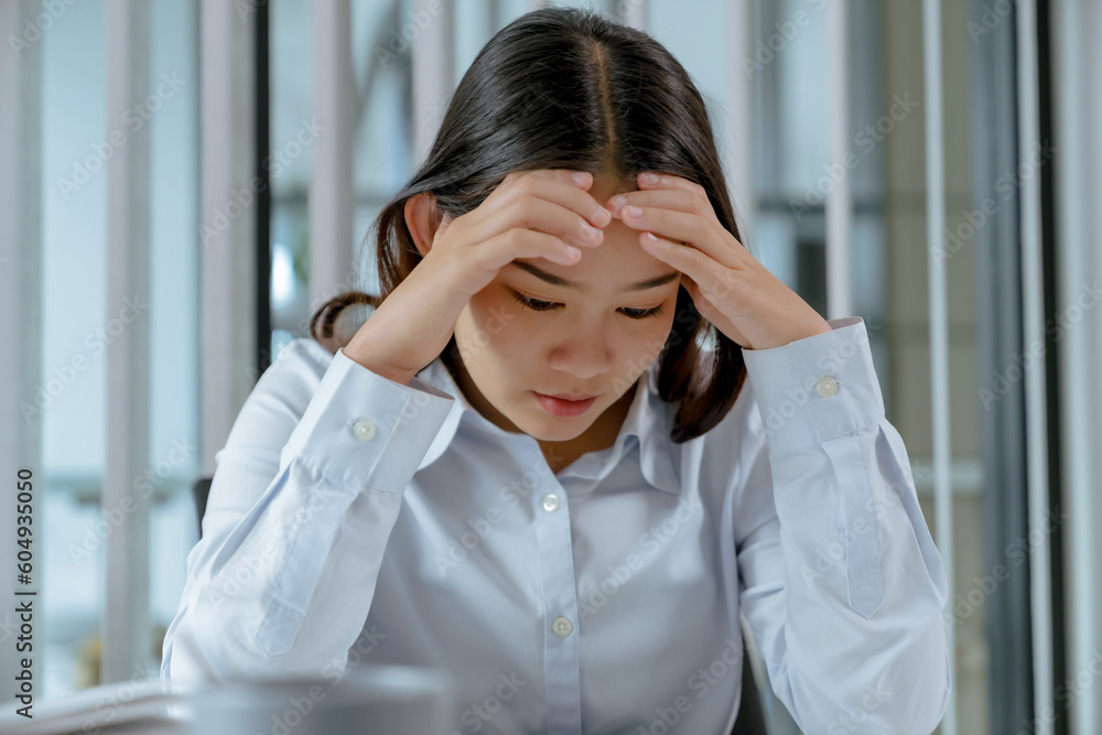 Tired asian business woman overworking and headache stressed. Tired asian business woman overworking and headache stressed.