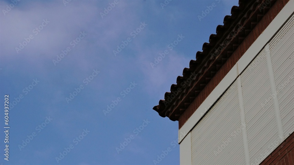 tile roof cornice against the sky tile roof cornice against the sky