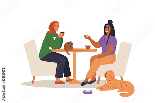 Girlfriends in pet-friendly cafe with cat and dog . Women talking and drinking. Flat vector illustration.