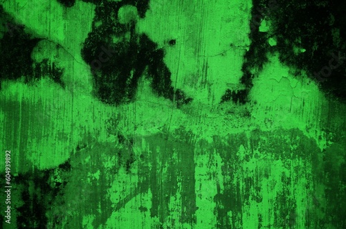 A dark and textured pattern of old, dirt-covered green backgrounds with an abstract effect.