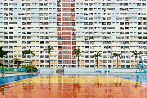 Basketball court in front of apartment photo