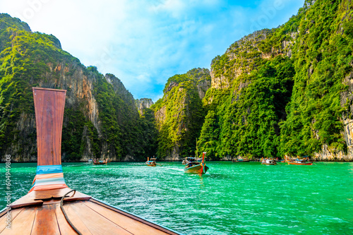 View of Pi Leh lagoon (also known as Green Lagoon) at Ko Phi Phi islands, Thailand. View from typical long tailed boat. Typical Thai picture of tropical paradise. Limestone rock and turquoise water. © Martin