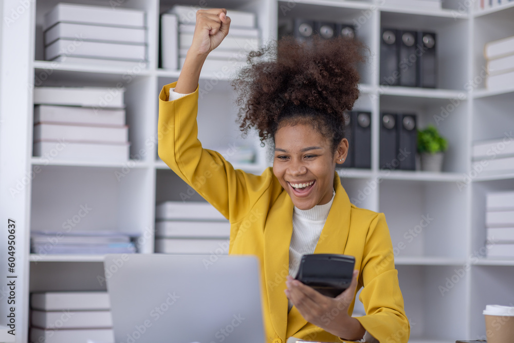 Excited african american woman sit at desk feel euphoric win online lottery, happy black woman overjoyed get mail at tablet being promoted at work, biracial girl amazed read good news at computer - obrazy, fototapety, plakaty 