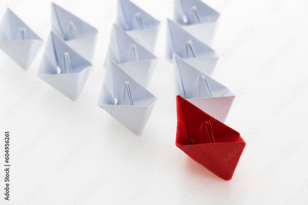 The red origami boat is leader The red origami boat is leader