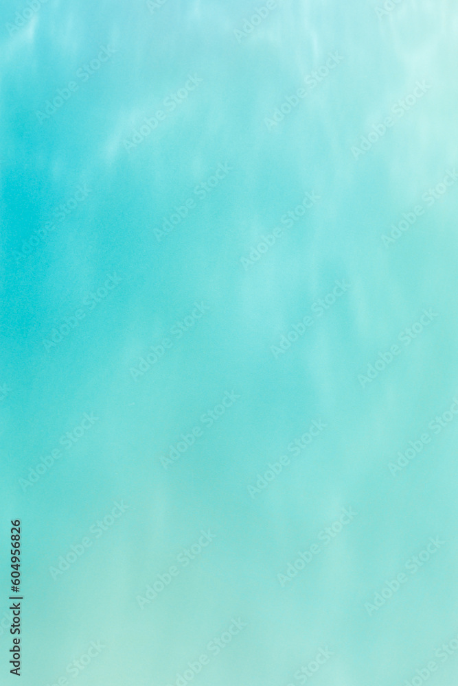 Defocused abstract background seawater gradient color, blue, turquoise, green, mint colors. Different tints sea water as blurred wallpaper, fon, backdrop, design elements. Pastel colored summer tones