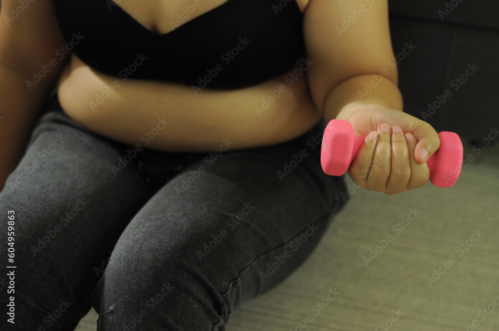 Fototapeta premium Fat woman with tight clothing worried about weight diet lifestyle concept.