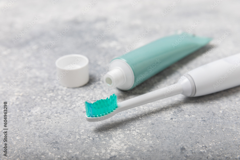 Toothbrush and tube of toothpaste on marble background with copy space. Flat lay. Oral hygiene. Oral Care Kit. Dentist concept. Place for text. Place to copy. Toothbrush and tube of toothpaste on marble background with copy space. Flat lay. Oral hygiene. Oral Care Kit. Dentist concept. Place for text. Place to copy.