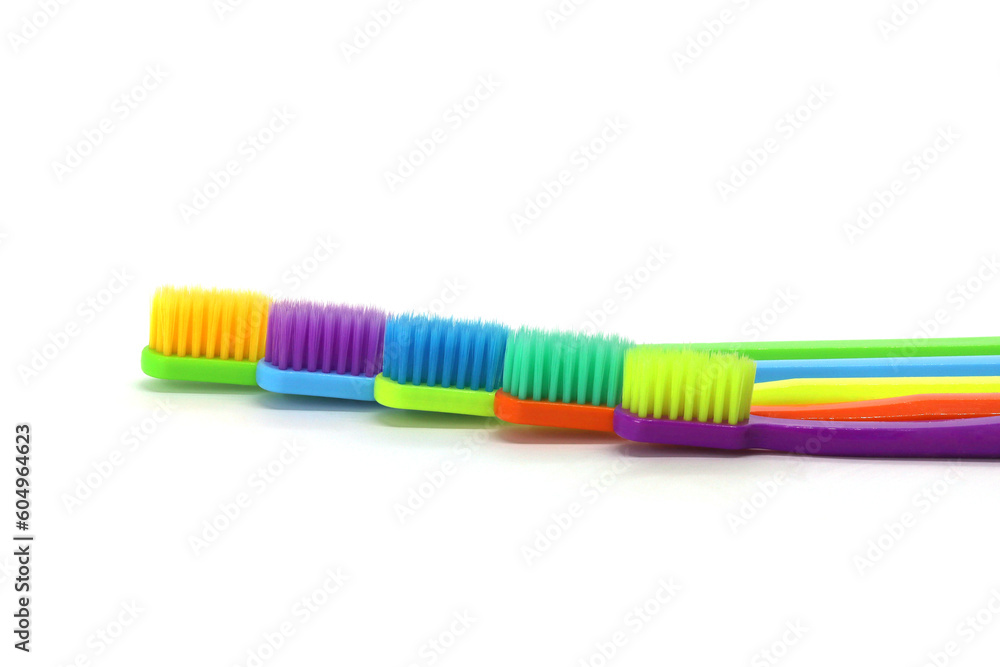 Multicolored toothbrushes isolated on white background Multicolored toothbrushes isolated on white background