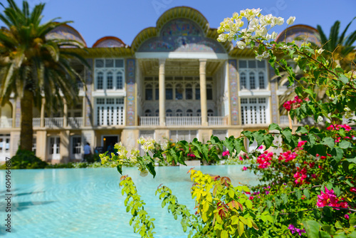 Persian garden of Eram with its beautiful pavilion, traditional Iranian fountain system and Palm trees in city of Shiraz, Iran. photo