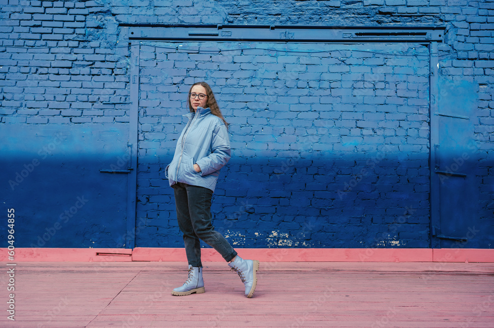 Portrait of a stylish woman in blue jacket. Spring outdoor portrait. Portrait of a stylish woman in blue jacket. Spring outdoor portrait.