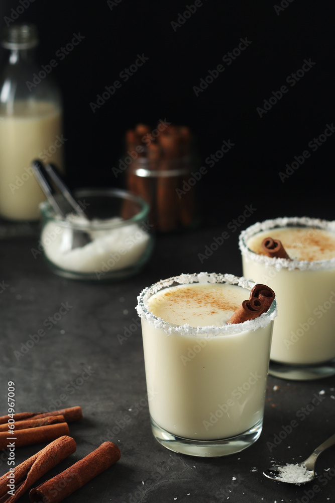 Two glasses with traditional Puerto Rico cocktail Coquito Two glasses with traditional Puerto Rico cocktail Coquito