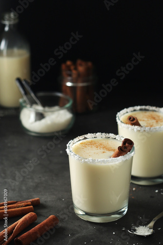Two glasses with traditional Puerto Rico cocktail Coquito © nastyakamysheva