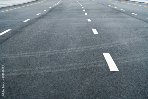 Asphalt road with white dashed lines