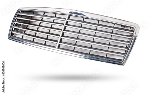 radiator grille on a white background made of shiny chromed metal is an element of the car body that protects and passes air to the engine. Design element and tuning replacement in the workshop.