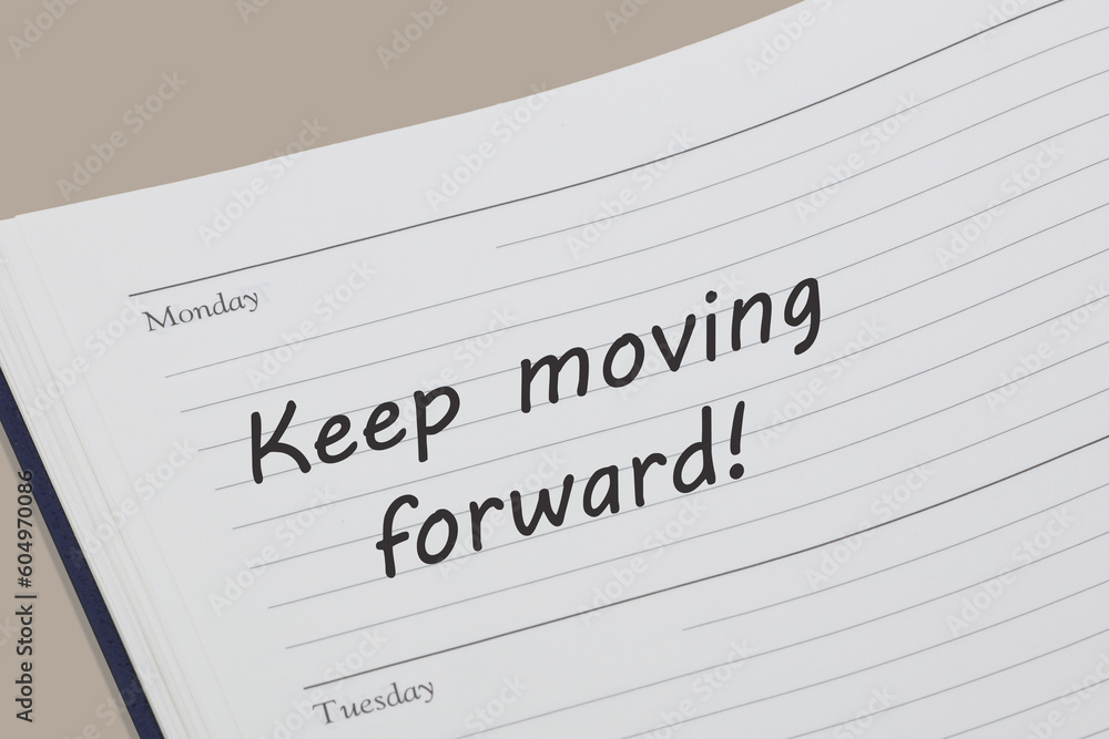 Keep moving forward diary reminder appointment open on desk Keep moving forward diary reminder appointment open on desk
