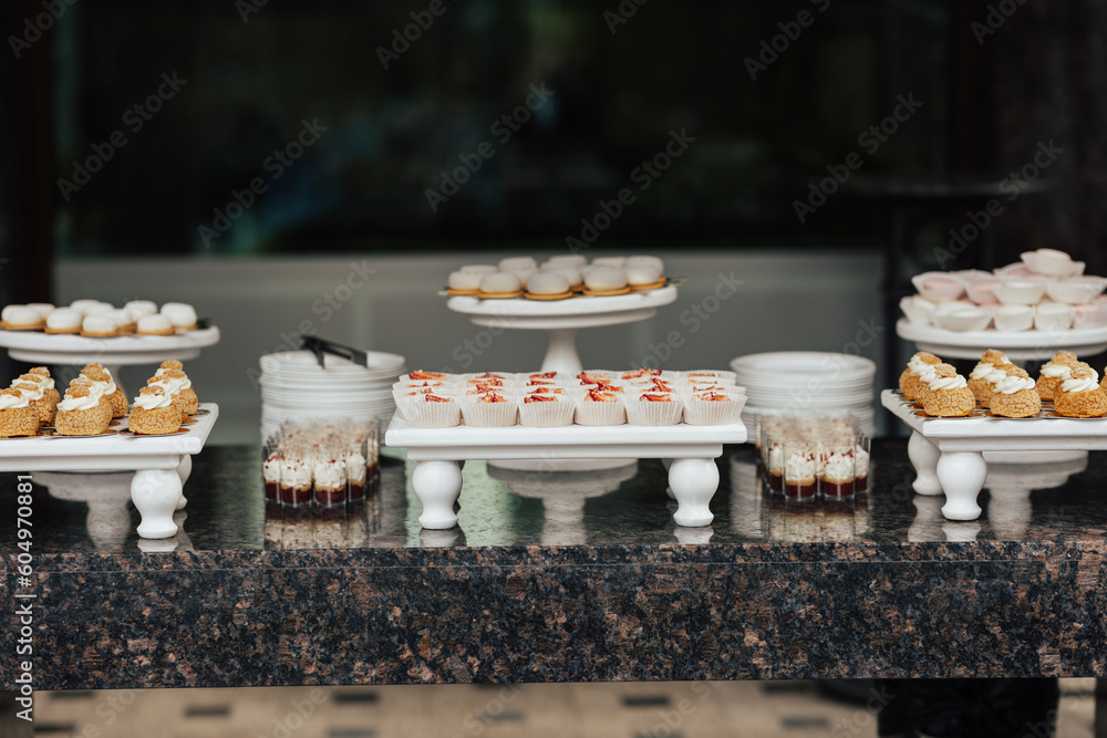 Candy bar for holidays. Reception for guests. Festively met guests with desserts, tarts and cupcakes.