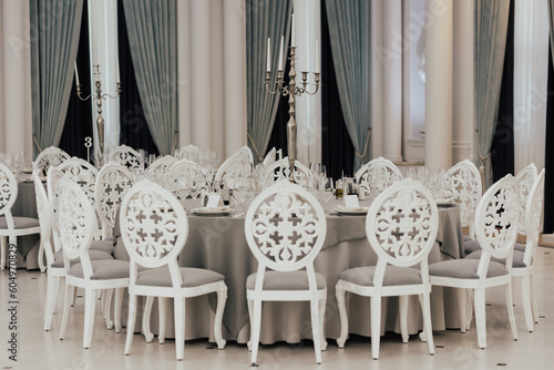 Served table for wedding ceremony, decorated with candles in the luxury restaurant.	

