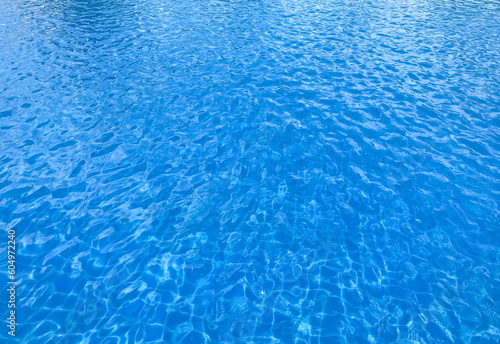 Photo of Water in a swimming pool with sunny reflections