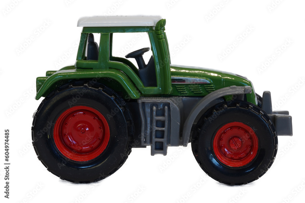 Obraz premium green toy tractor isolated on white