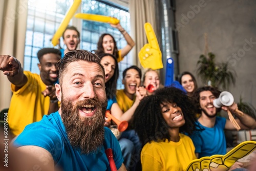 Bild auf Leinwand Happy supporter taking selfie with multiethnic joyful sport fans while watching