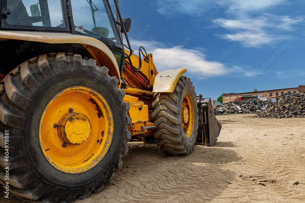 Details of modern red tractor close up. Big powerful industrial heavy bulldozer. Details of modern red tractor close up. Big powerful industrial heavy bulldozer.