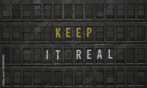 Text keep it real typed on retro typewriter photo