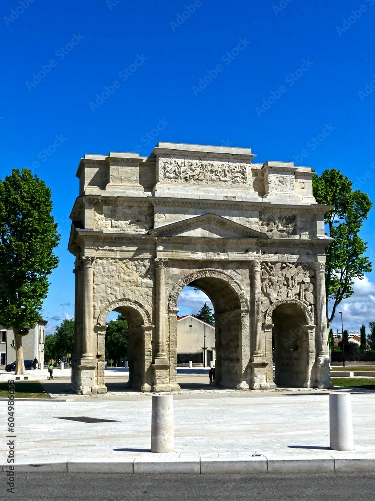 Fototapeta premium Orange, May 2023 : Visit the beautiful city of Orangeen Provence - Historical city with its arena and ancient theater - View on the triumphal arch