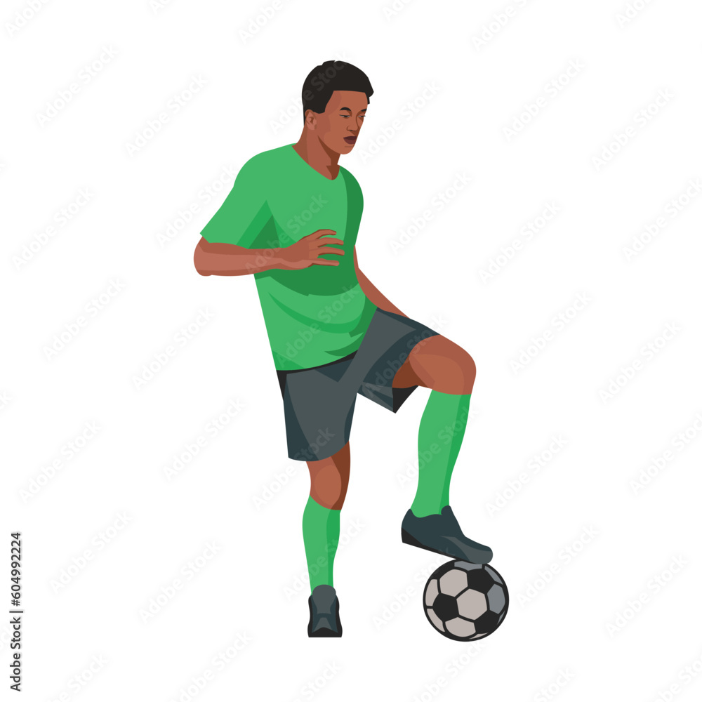 Southern African Football player stands in a half-turn, placing his foot on the ball Southern African Football player stands in a half-turn, placing his foot on the ball