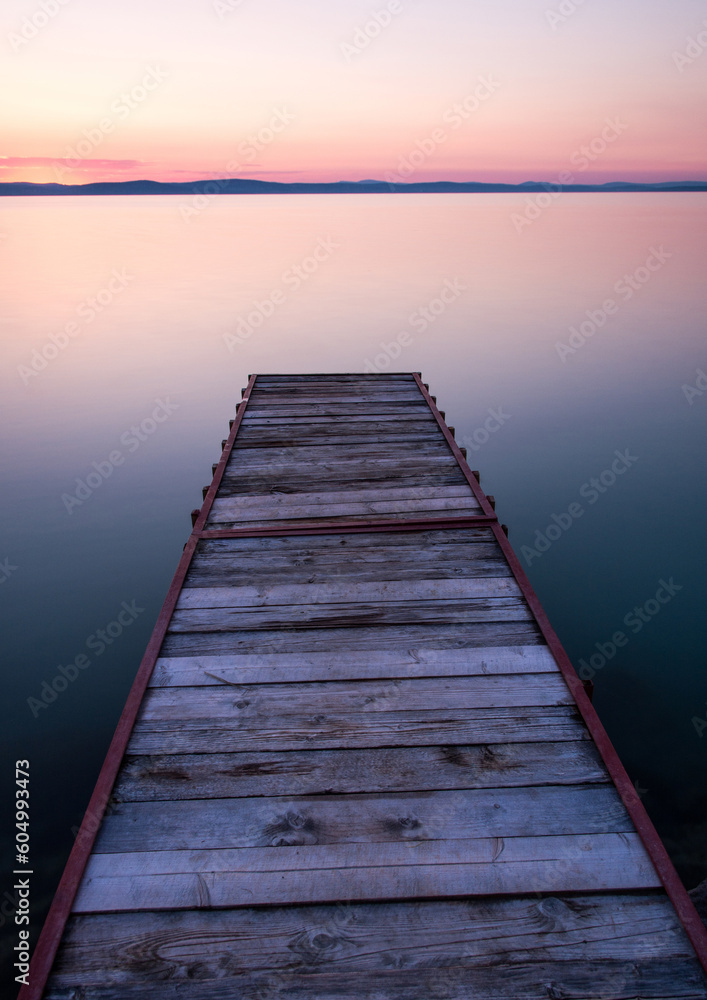 jetty at beach with sunset