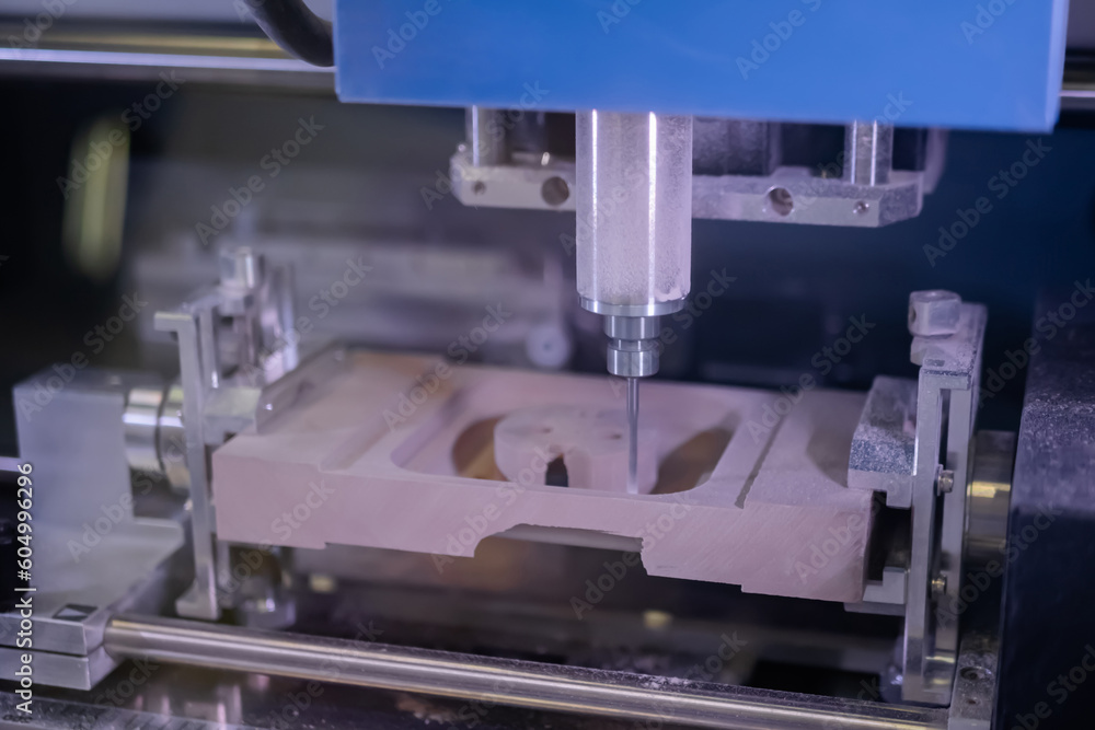 Automated milling machine cutting wooden workpiece from wood pulp, making 3d model at technology exhibition, factory. CNC engraving, woodworking, carving, industrial, manufacturing concept. Automated milling machine cutting wooden workpiece from wood pulp, making 3d model at technology exhibition, factory. CNC engraving, woodworking, carving, industrial, manufacturing concept.