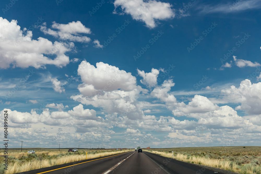Rural country road and blue sky with clouds