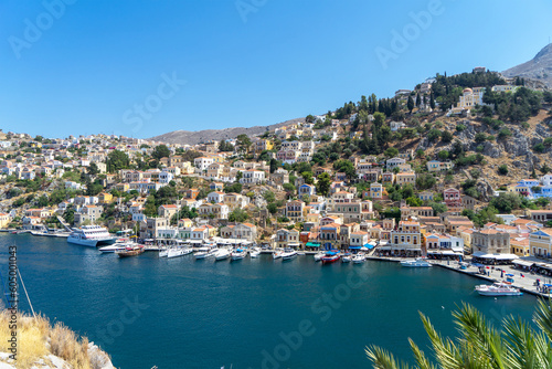 Houses of island Symi or Simi, Greek mountainous island and municipality, part of Dodecanese island chain. Harbor town of Symi and adjacent upper town Ano Symi