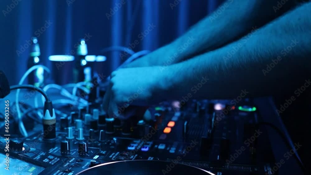 DJ's hand fast mixing music in the night party DJ's hand fast mixing music in the night party