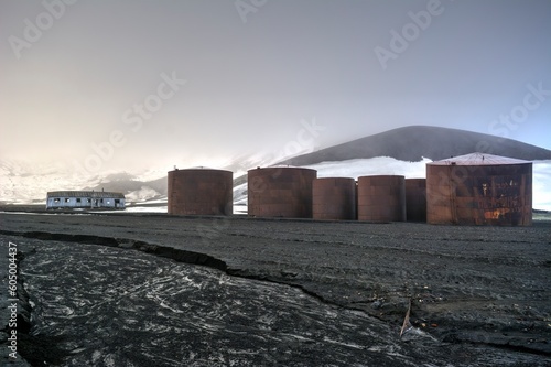 Photo of a group of tanks in a barren field in Antarctica