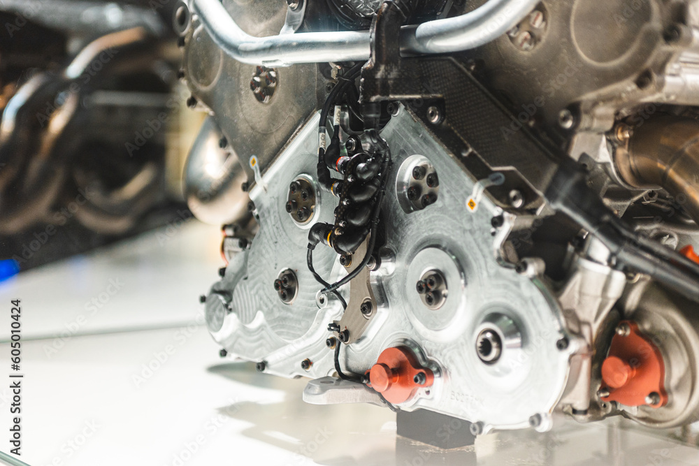 Detailed front view of  crankshaft aluminum cover from a high-performance V10 power unit of a F1 car