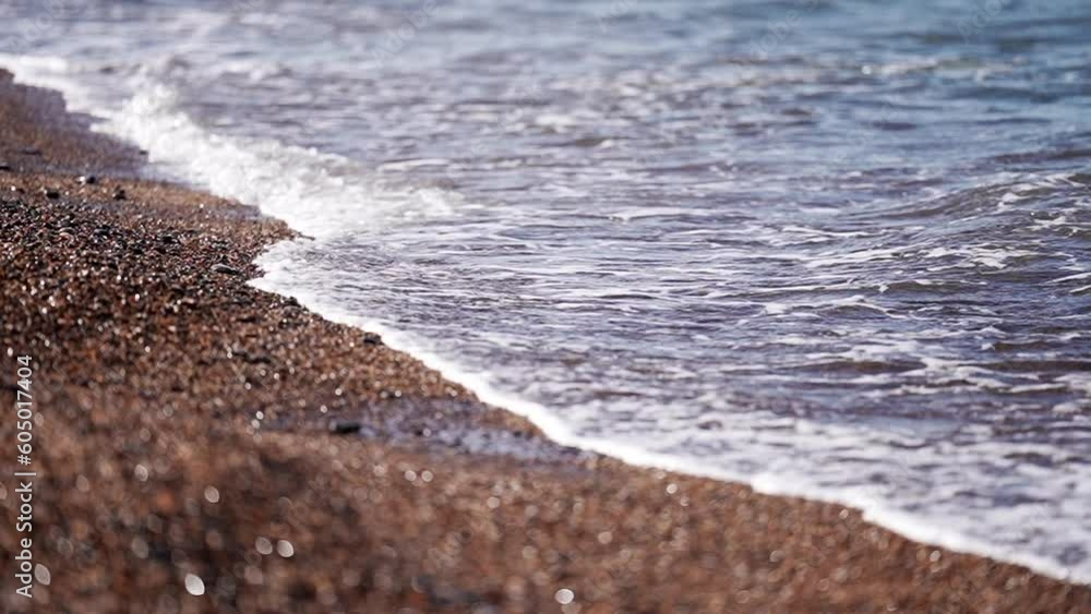 Waves of Mediterranean Sea rolling in sunshine to the sandy beach. Beautiful Danmark nature. Close-up shot of calming foamy water. Beautiful ocean shore waves, slow motion, Beautiful ocean shore waves Waves of Mediterranean Sea rolling in sunshine to the sandy beach. Beautiful Danmark nature. Close-up shot of calming foamy water. Beautiful ocean shore waves, slow motion, Beautiful ocean shore waves
