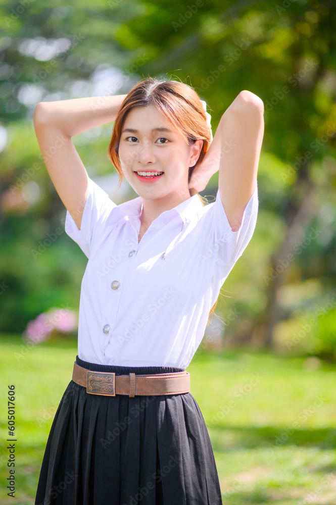 happy cheerful attractive asian girl in Thai University Student Uniform in park outdoor happy cheerful attractive asian girl in Thai University Student Uniform in park outdoor
